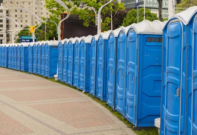 a line of portable restrooms at a sporting event, providing athletes and spectators with clean and accessible facilities in Barrington, RI